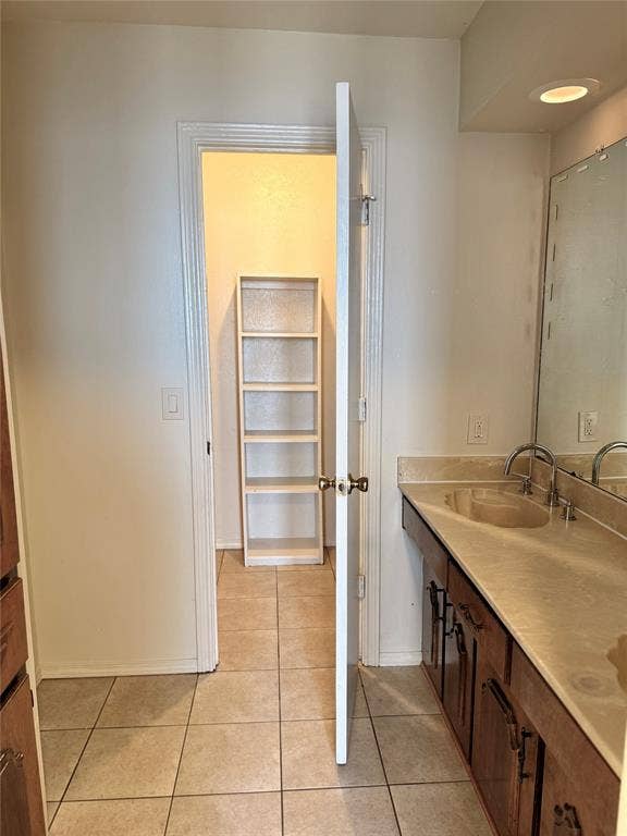 Primary bathroom with double vanities and spacious closet.