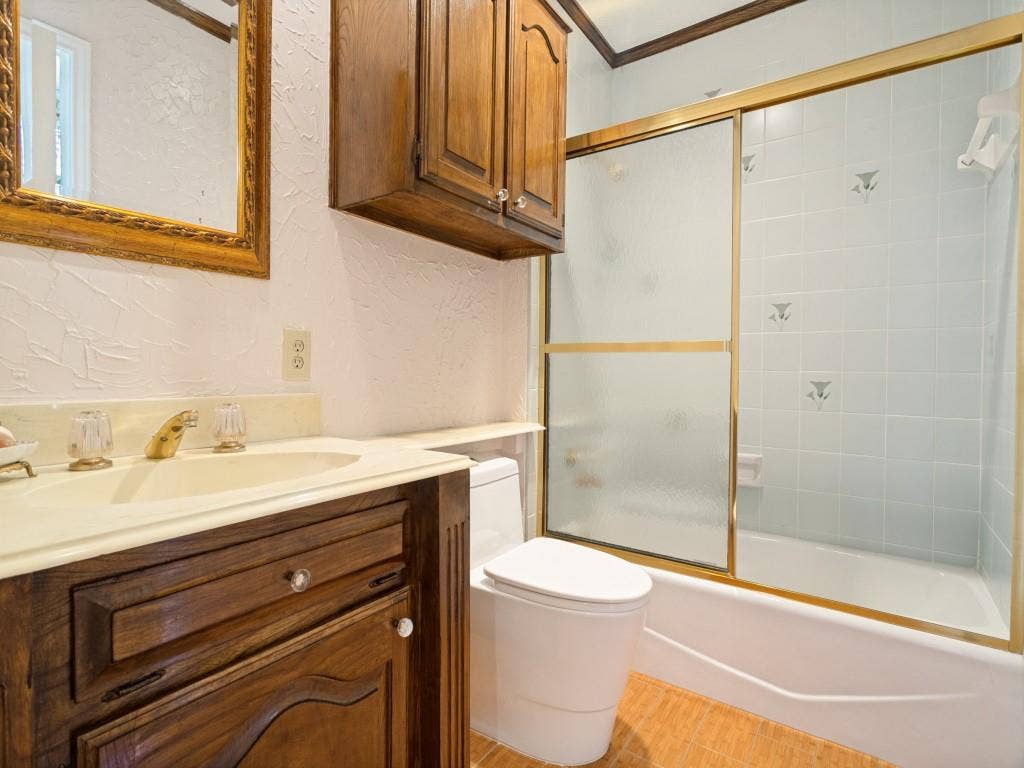 The bathroom is attached to the library