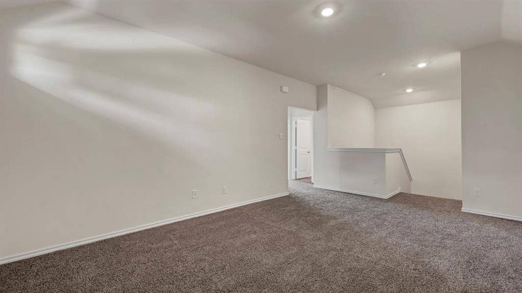 231 Yates Street, Bullard, TX 75757 Spacious interior with neutral-toned walls, recessed lighting, and carpet flooring