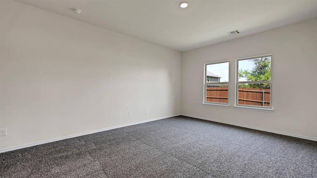 231 Yates Street, Bullard, TX 75757 Neutral wall paint, plush carpet flooring, recessed ceiling lighting, and dual pane windows