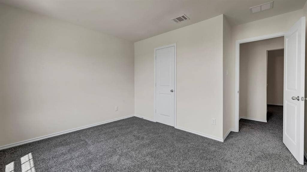 231 Yates Street, Bullard, TX 75757 Neutral wall finishes, recessed ceiling vents, grey carpeting, and white interior doors