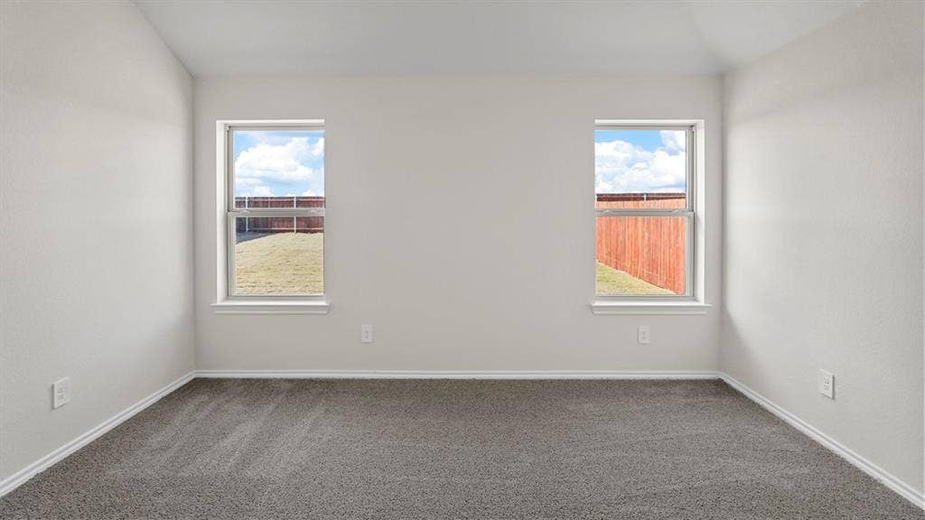 189 Brooks Street, Bullard, TX 75757 Neutral wall color, grey carpeting, and two windows with white trim