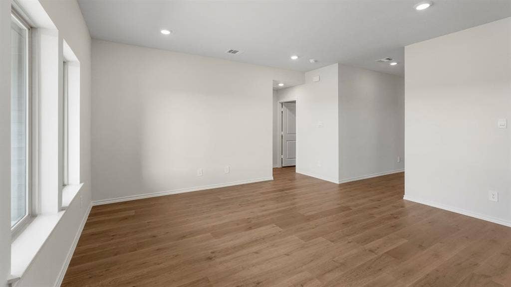 189 Brooks Street, Bullard, TX 75757 Recessed lighting, wood-finish flooring, white walls, and multiple windows