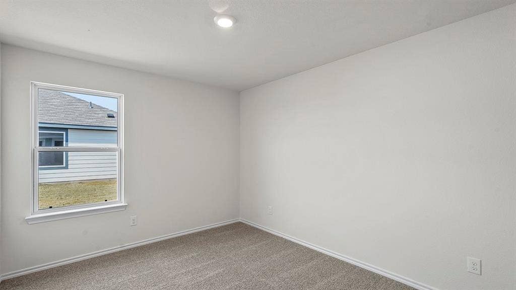 215 Yates Street, Bullard, TX 75757 Recessed ceiling lighting, neutral-toned walls, double-hung window, and carpet flooring