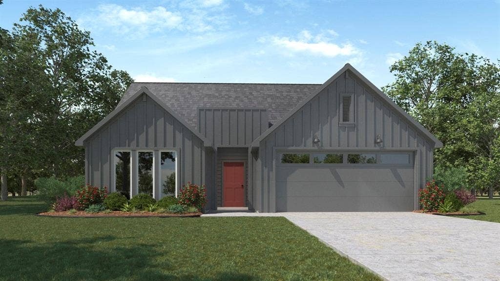 215 Yates Street, Bullard, TX 75757 Contemporary exterior featuring vertical siding, an attached garage, a red entry door, and a concrete driveway