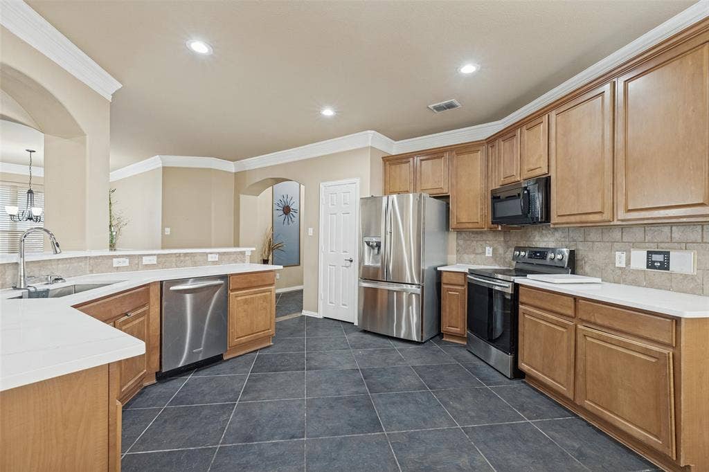 Kitchen featuring, stainless steel appliances and ample cabinets