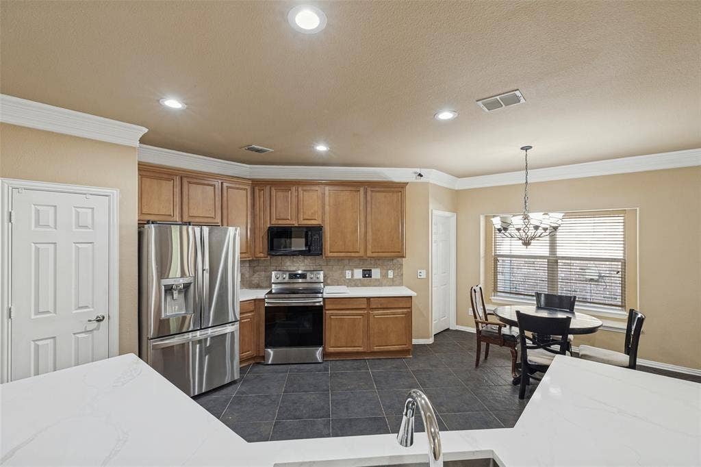 Kitchen featuring recessed lighting, and crown molding