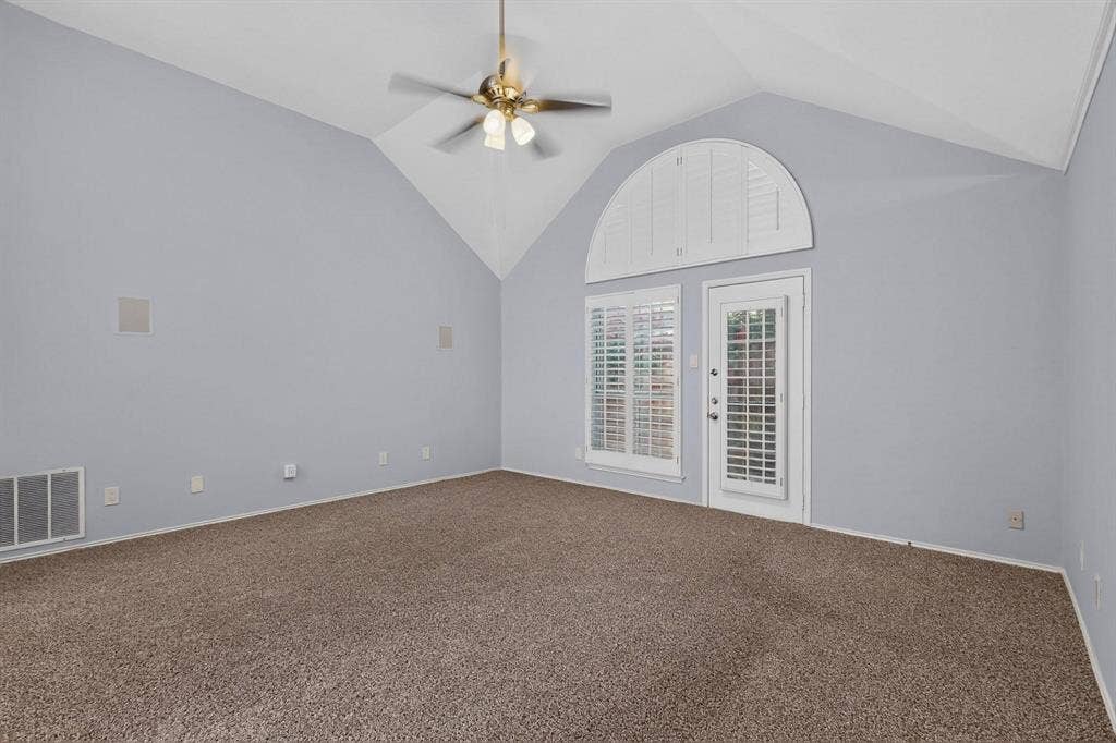 2702 Garden Springs Drive, Richardson, TX 75082 Vaulted ceiling with a brass-finish ceiling fan and light fixture