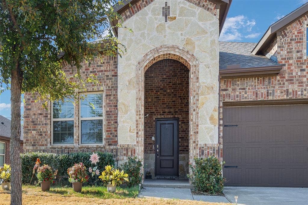 1101 Crepe Myrtle Lane, Anna, TX 75409 Brick and stone facade featuring an arched entryway
