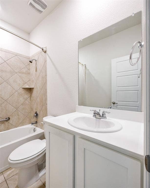 1101 Crepe Myrtle Lane, Anna, TX 75409 Bathroom featuring a white vanity with an integrated sink, polished chrome fixtures, a tiled tub-shower combination with a built-in shelf, and a wall-mounted mirror