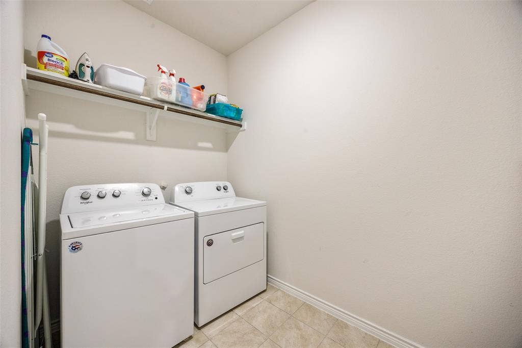 1101 Crepe Myrtle Lane, Anna, TX 75409 Dedicated laundry space with a built-in shelf for storage and tile flooring