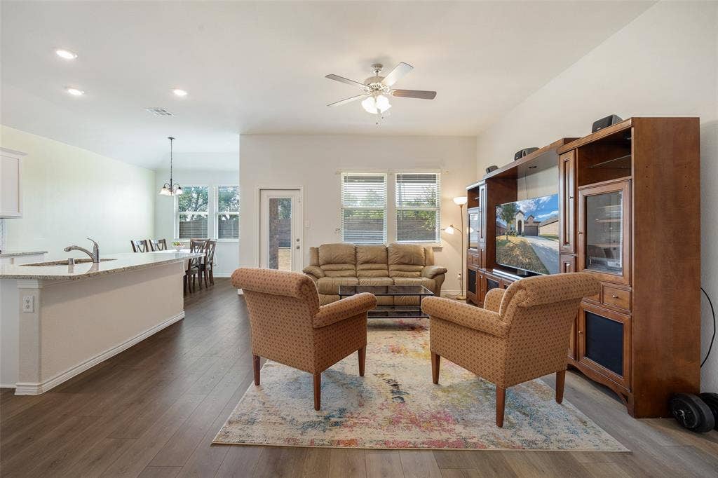 1101 Crepe Myrtle Lane, Anna, TX 75409 Open-concept living space featuring wood-finish flooring, recessed lighting, and a ceiling fan