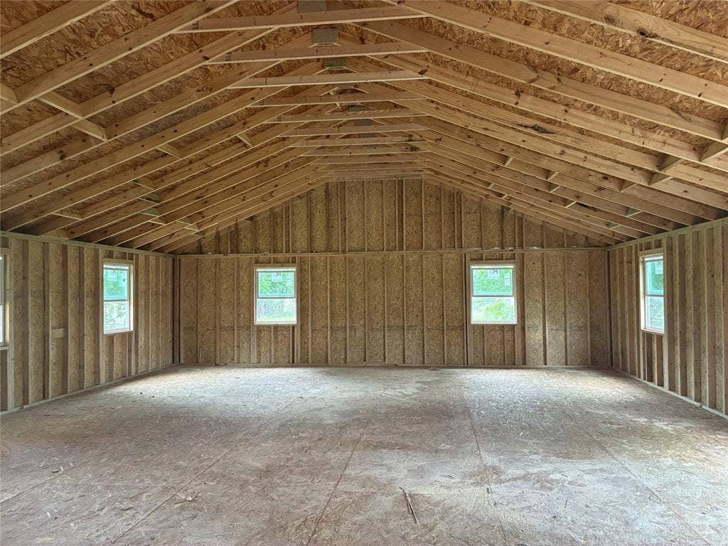 13601 Woodridge, Eustace, TX 75124 Vaulted ceiling framing, exposed rafters, and multiple windows