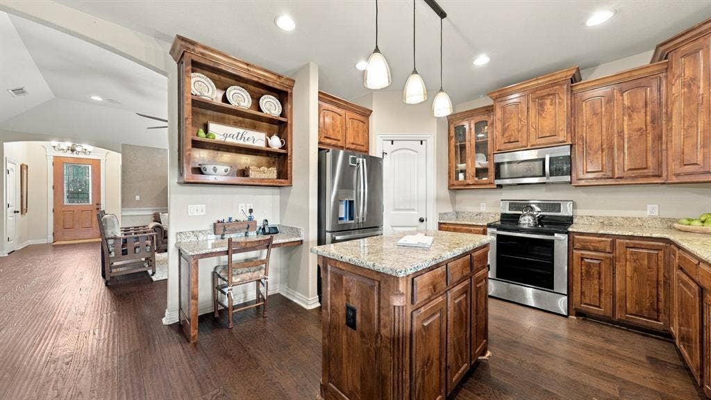 6503 Pirlie Court, Granbury, TX 76049 Kitchen with built in desk area.