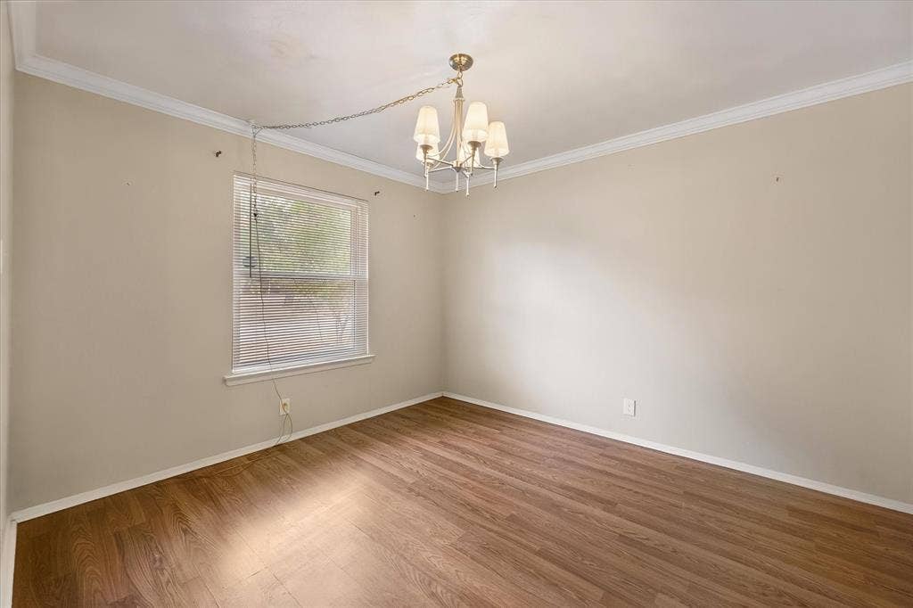 144 Jill Ann Drive, Burleson, TX 76028 Recessed window with blinds, wood-finish flooring, and crown molding