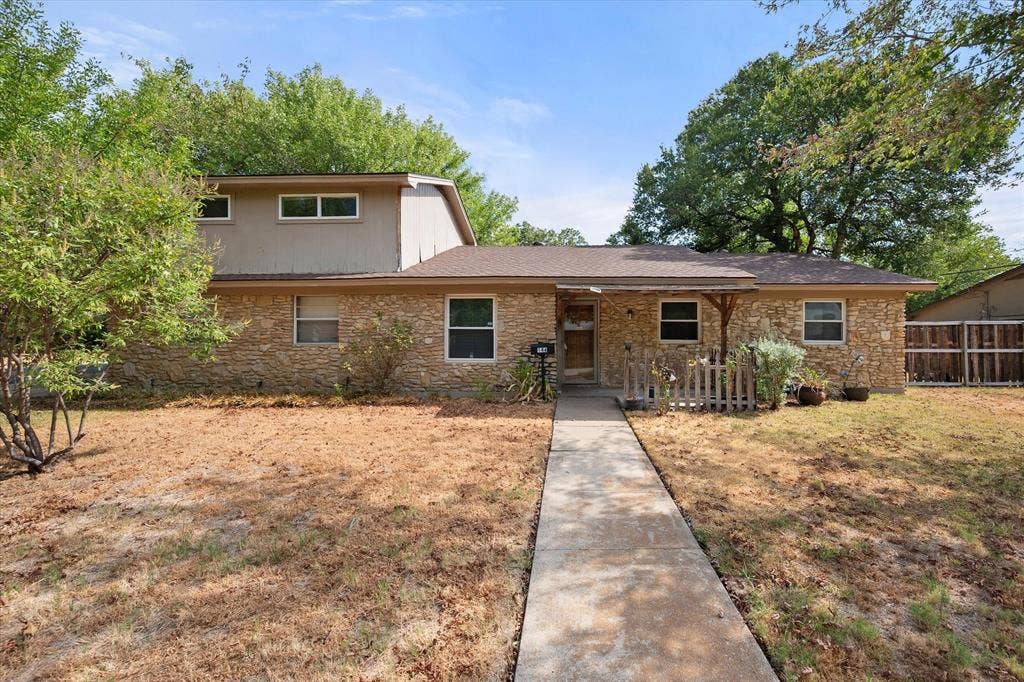 144 Jill Ann Drive, Burleson, TX 76028 Stone veneer facade with a covered entry