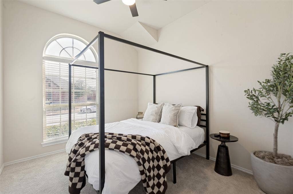 1929 Day Break Drive, Lancaster, TX 75146 Vaulted ceiling with a ceiling fan, arched transom window, window blinds, and light-toned wall paint