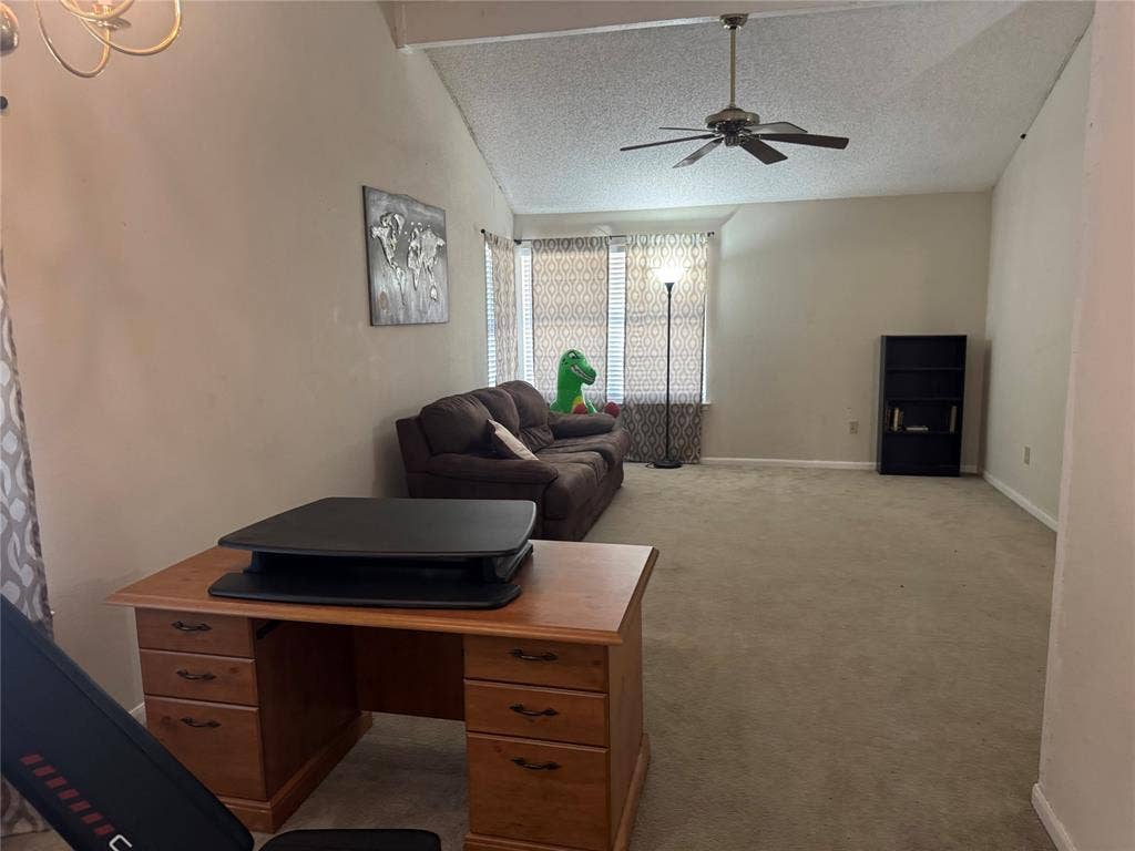 2681 Steppington Street, Grand Prairie, TX 75052 Vaulted ceiling, ceiling fan, chandelier, carpeted flooring, tiled flooring in entryway