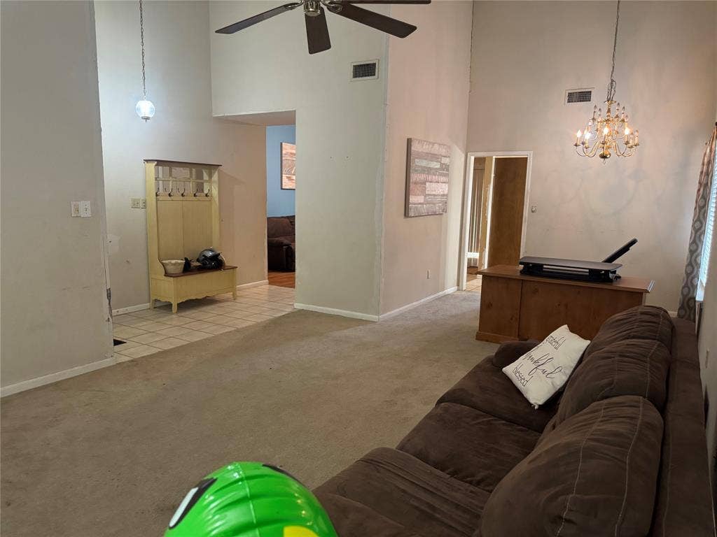 2681 Steppington Street, Grand Prairie, TX 75052 U-shaped kitchen with wood cabinetry, light-toned countertops, and stainless steel appliances