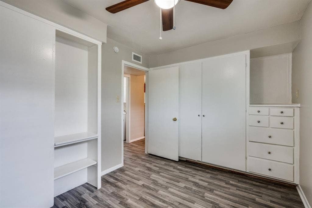 2213 Capri Drive, #208, Fort Worth, TX 76114 Built-in storage solutions, wood-finish flooring, and a ceiling fan