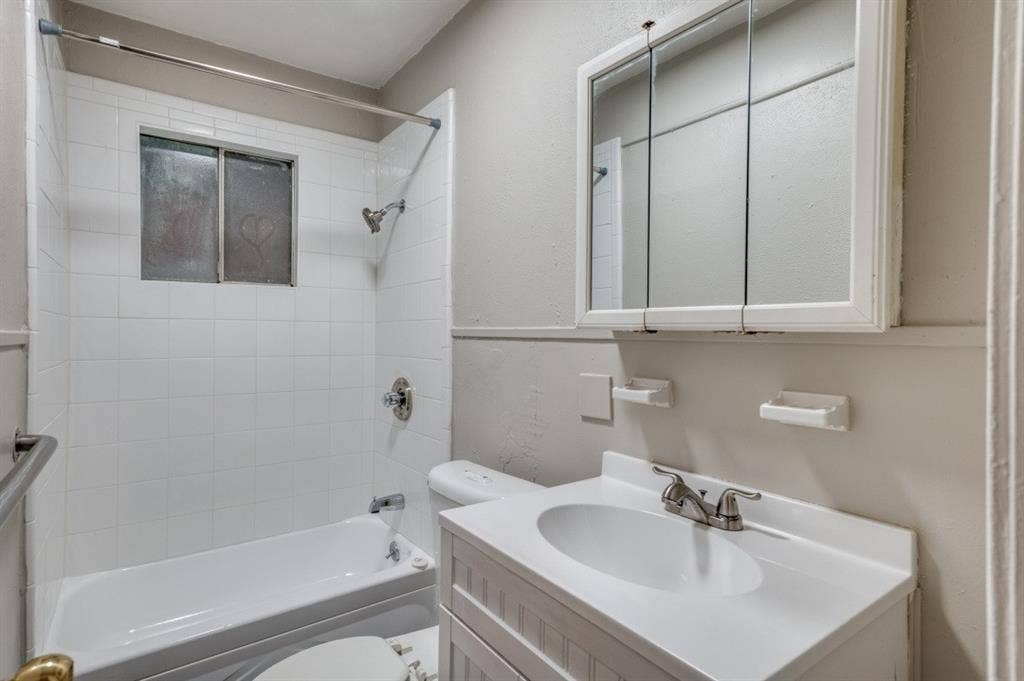 2213 Capri Drive, #208, Fort Worth, TX 76114 White subway tile shower surround with a built-in window