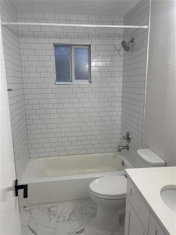 425 N Rosemont Avenue, #111, Dallas, TX 75208 White subway tile shower surround, shower/tub combination, frosted window, modern vanity with integrated sink, and large format floor tile