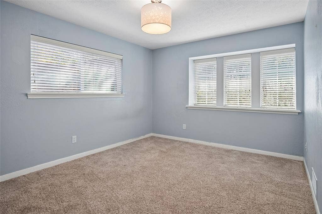 This bedroom offers a walk-in closet.