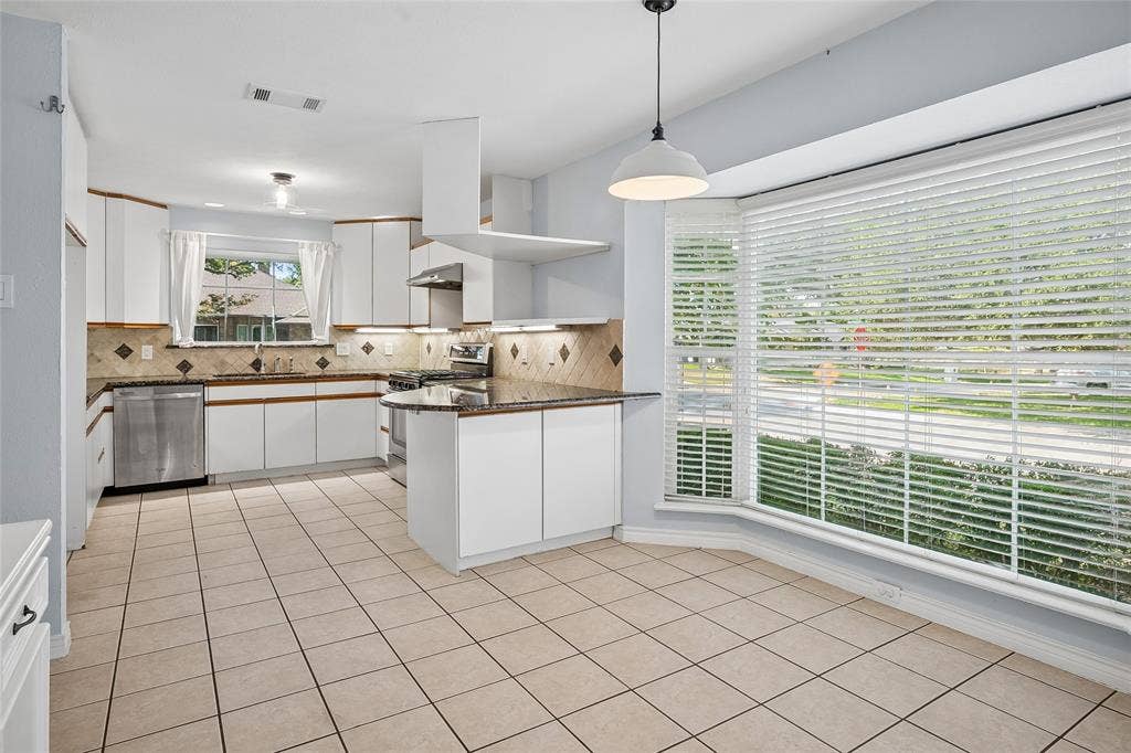 Family and friends can enjoy a spacious, relaxed setting.  Stainless appliances include a gas range with overhead vent.