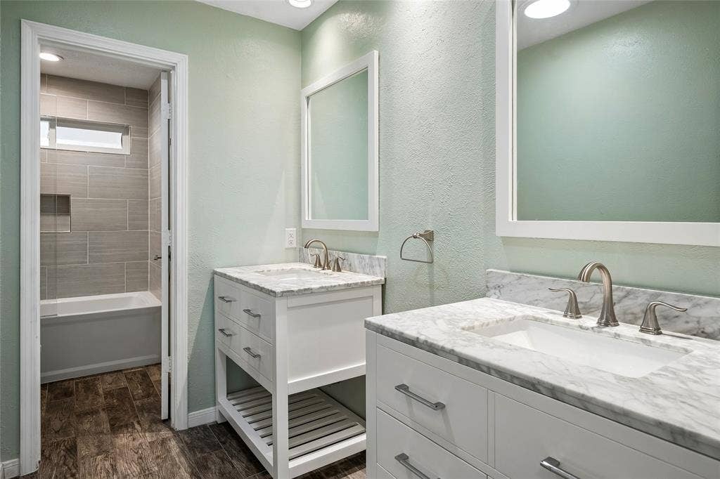 Charming full secondary bath with separate vanities