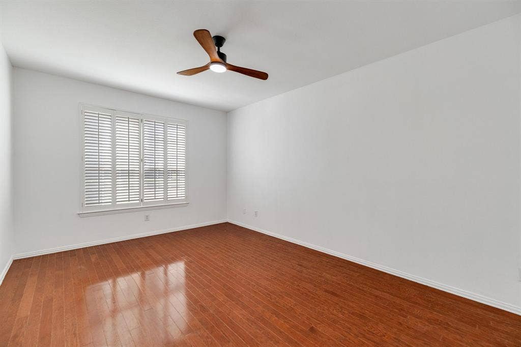 239 Glen Ridge Drive, Murphy, TX 75094 Hardwood flooring, plantation shutters, and a ceiling fan