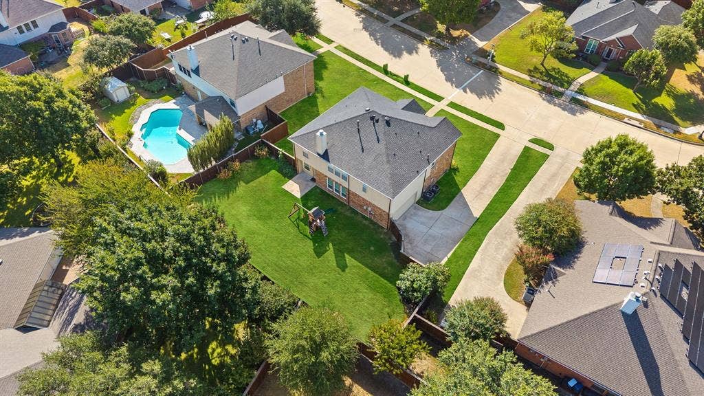 239 Glen Ridge Drive, Murphy, TX 75094 Expansive property with a private backyard, mature trees, and a concrete driveway