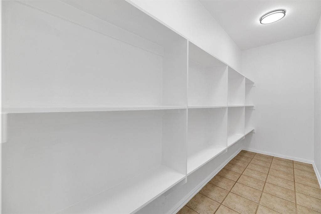 239 Glen Ridge Drive, Murphy, TX 75094 Built-in shelving, recessed ceiling light fixture, and tile flooring