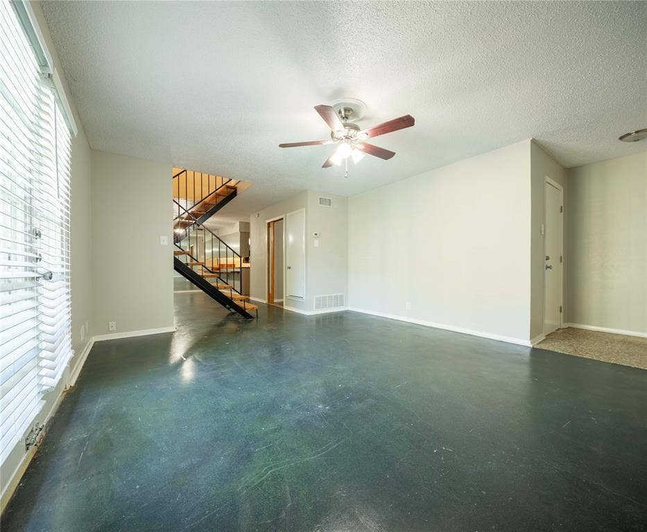1717 N Locust Street, #1, Denton, TX 76201 Polished concrete flooring with a ceiling fan light fixture