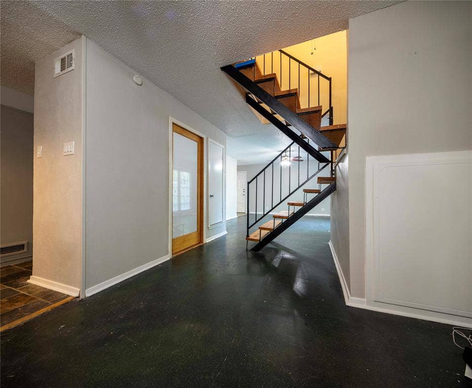 1717 N Locust Street, #1, Denton, TX 76201 Open-tread staircase with wood stairs and black metal railing