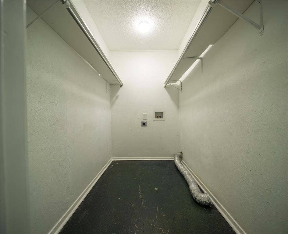 1717 N Locust Street, #1, Denton, TX 76201 Dedicated utility area with appliance hookups, overhead lighting, and integrated shelving