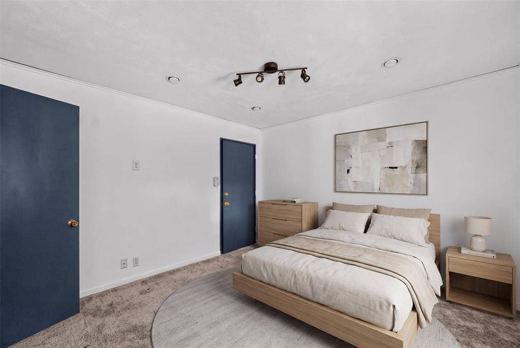 5630 Vanderbilt Avenue, Dallas, TX 75206 White walls complemented by two blue doors, recessed lighting, and a track light fixture