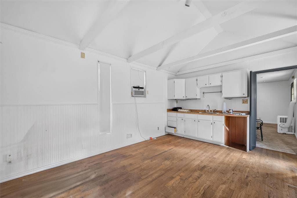 5630 Vanderbilt Avenue, Dallas, TX 75206 Wood-finish flooring with exposed ceiling beams and beadboard wall paneling