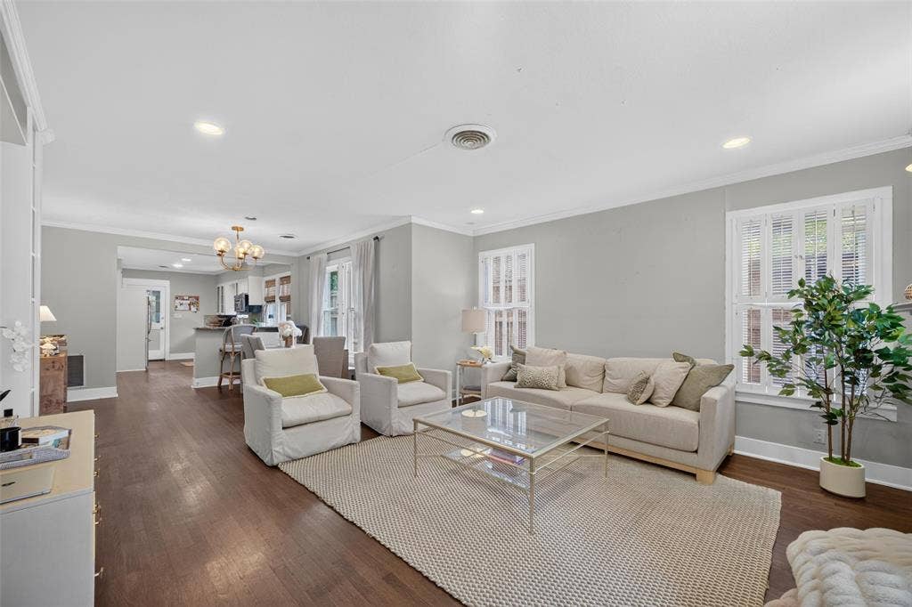 5630 Vanderbilt Avenue, Dallas, TX 75206 Wood-finish flooring throughout, recessed lighting, crown molding, double windows, and a built-in kitchen island with seating