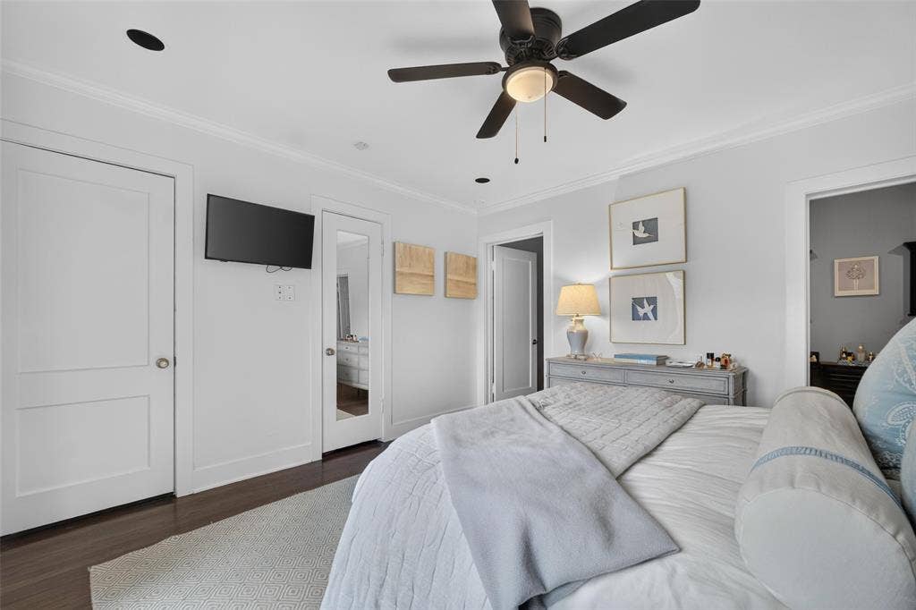 5630 Vanderbilt Avenue, Dallas, TX 75206 Recessed ceiling lighting, ceiling fan with light fixture, wood-finish flooring, crown molding, and panel doors