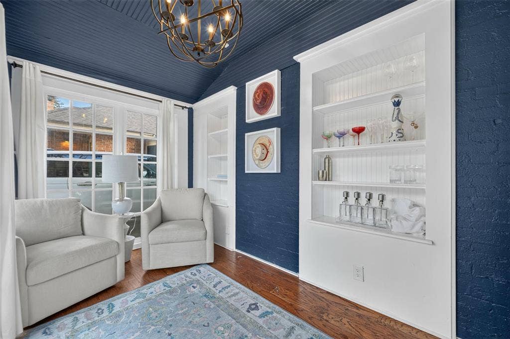 5630 Vanderbilt Avenue, Dallas, TX 75206 Hardwood flooring, built-in shelving, ornate chandelier, window with grid panes, textured wall finish