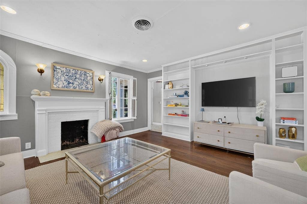 5630 Vanderbilt Avenue, Dallas, TX 75206 Hardwood-finish flooring complementing a white mantel and fireplace