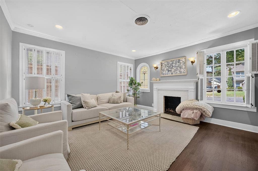 5630 Vanderbilt Avenue, Dallas, TX 75206 Dark wood-finish flooring, white crown molding, recessed lighting, and a white fireplace mantel