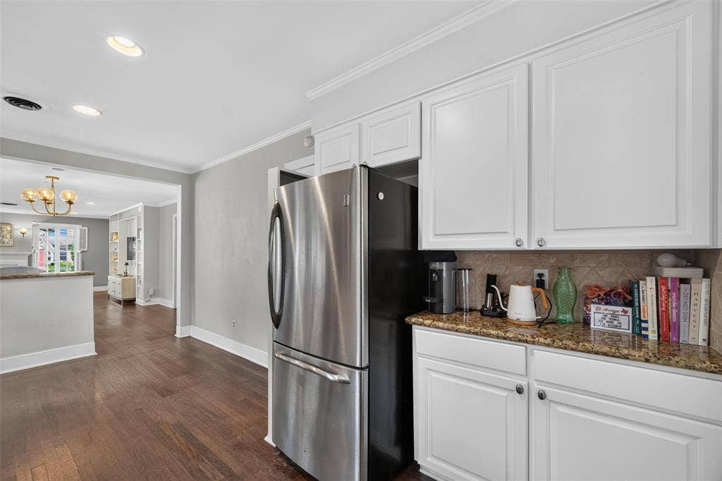 5630 Vanderbilt Avenue, Dallas, TX 75206 Kitchen with white cabinetry, granite countertops, and stainless steel refrigerator
