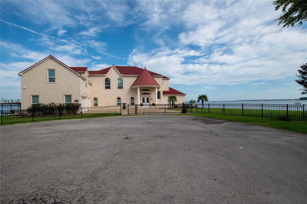 241 Loon Bay Drive, Gun Barrel City, TX 75156 Wrought iron fence with private gate to driveway and 3 car garage