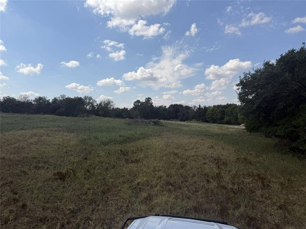 2016 Hoopers Court, Weatherford, TX 76085 Expansive open field with natural vegetation and distant tree lines