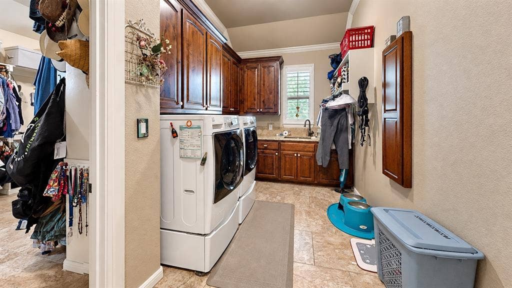 1729 Bent Tree Court, Granbury, TX 76049 Laundry room attached to the primary walk-in closet