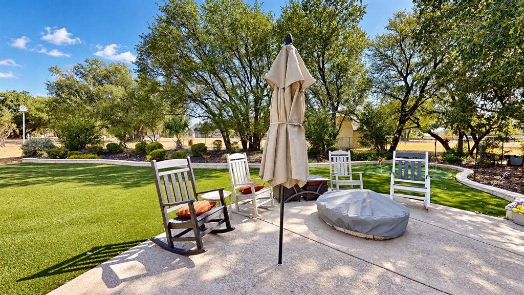 1729 Bent Tree Court, Granbury, TX 76049 Patio overlooking the pool and one of the putting greens
