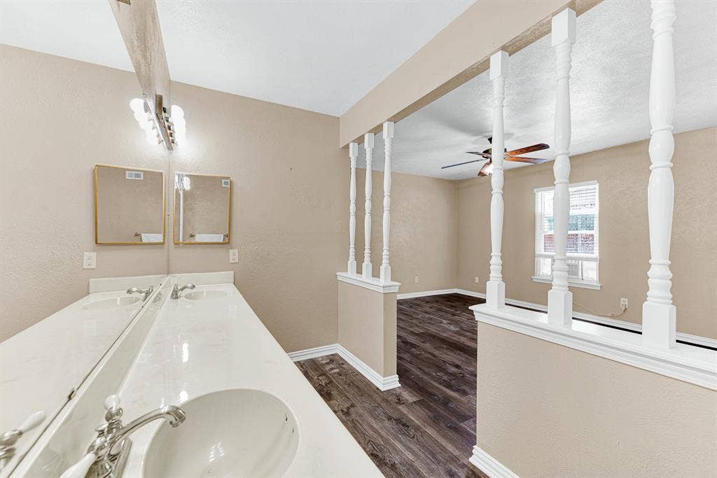 108 Kingsbridge Drive, Garland, TX 75040 Expansive backyard with a wood privacy fence and mature trees providing shade