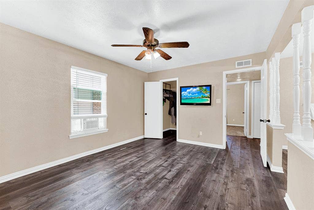 108 Kingsbridge Drive, Garland, TX 75040 Paved patio area, wood privacy fencing, mature trees, and landscaping