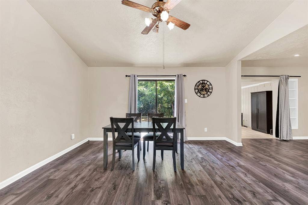 108 Kingsbridge Drive, Garland, TX 75040 Wood-finish flooring, vaulted ceiling, and ceiling fan with lighting